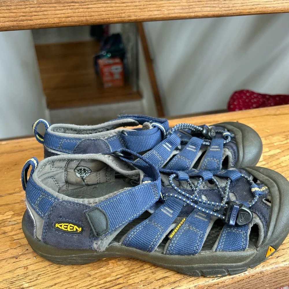 KEEN Kids' Newport H2 Sandals in a blue colorway hiking beach camp outdoors